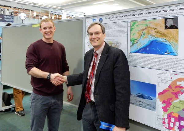 Photo by Kate Pendleton. Geology major Pat Terhune, left, accepts congratulations for his poster from Paul Layer, dean of the College of Natural Science and Mathematics, at the 2016 Research Day.