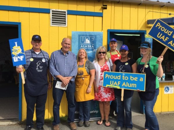 Photo courtesy UAFAA. Alaska Gov. Bill Walker, second from left, joins the gang at the UAF Alumni Association hamburger booth at the 2016 Tanana Valley State Fair.