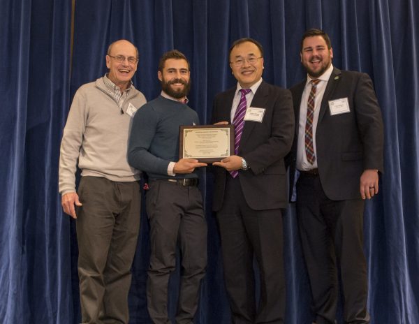 Nathan Belz, second from left, receives the 2018 PacTrans Research of the Year Award. Photo courtesy of the UAF Institute of Northern Engineering.