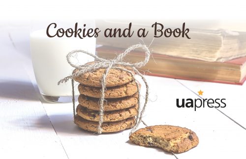 Picture of a stack of cookies wrapped up with twine in front of a glass of milk and two books. Another cookie is half-eaten.