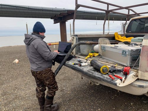 Noah Khalsa retrieves data from a SeaFET pH sensor in the Beaufort Sea for his senior thesis research. Photo courtesy of BLaST.