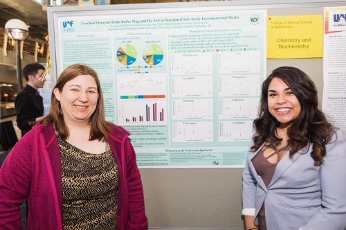 Jennifer Guerard poses with student Kiana Mitchell during a poster presentation event in 2018. UAF photo by JR Ancheta.