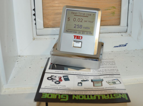 A TED home energy monitor collects energy use and associated cost data from a household in Gjoa Haven, Nunavut. Photo by Martha Lenio, WWF-Canada.
