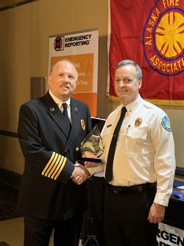 Doug Schrage, right, received the Warren B. Cummings Fire Chief of the Year Award in February 2020. Photo courtesy of Doug Schrage.