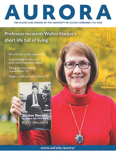 Cover of Aurora fall 2020 magazine, featuring a woman holding a book she wrote about Walter Harper.