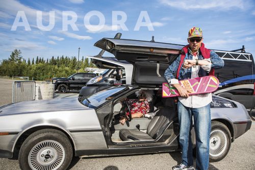 Cover image of Aurora with man standing in front of a DeLorean