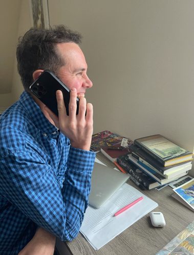 Alex Hirsch, an associate professor of political science and director of the Honors College, recorded a message of support for KUAC on his phone. Photo courtesy of KUAC.