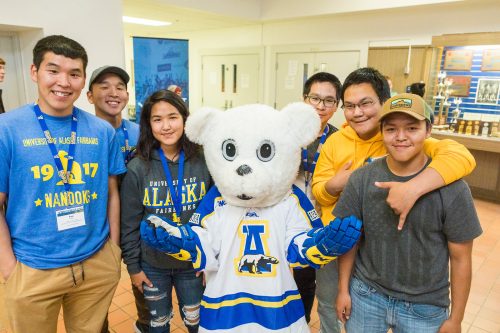 A group of students make a new friend at the 2018 New Student Orientation. UAF photo by JR Ancheta.