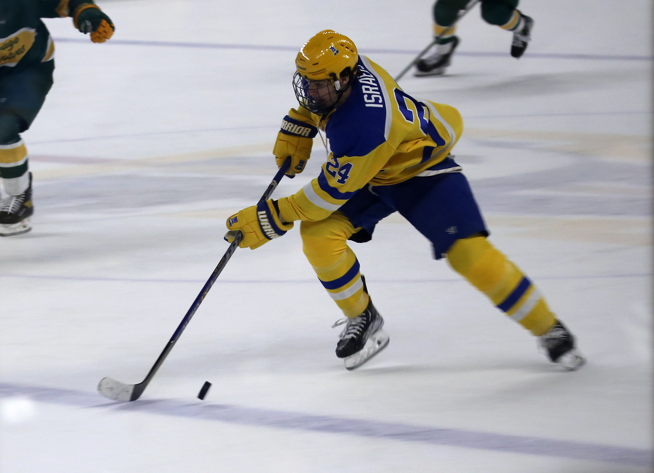 Nanooks forward Harrison Israels rushes the puck forward in a push toward the Seawolves' net and 'Nooks forward Brady Risk who slotted the winner home only 58 seconds into the overtime period.