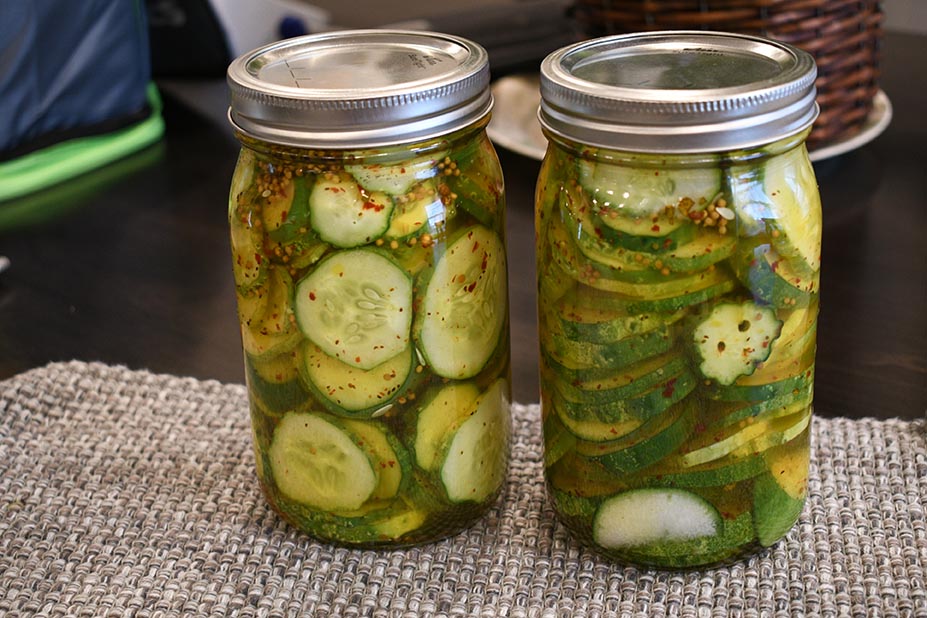 Two jars with pickle slices