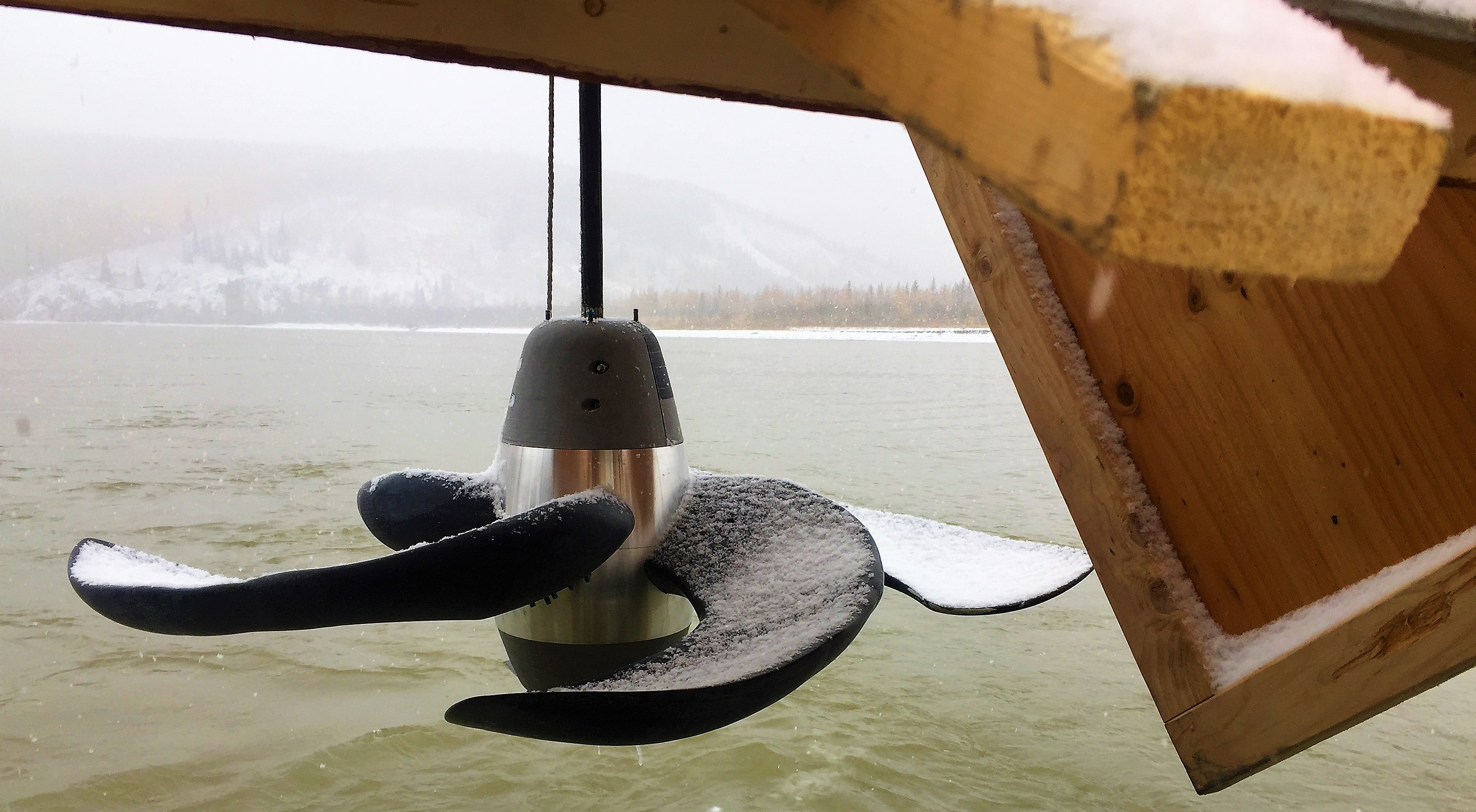 The BladeRunner turbine protoype hangs above the Tanana River from a test barge at the Tanana River Test Site near Nenana.