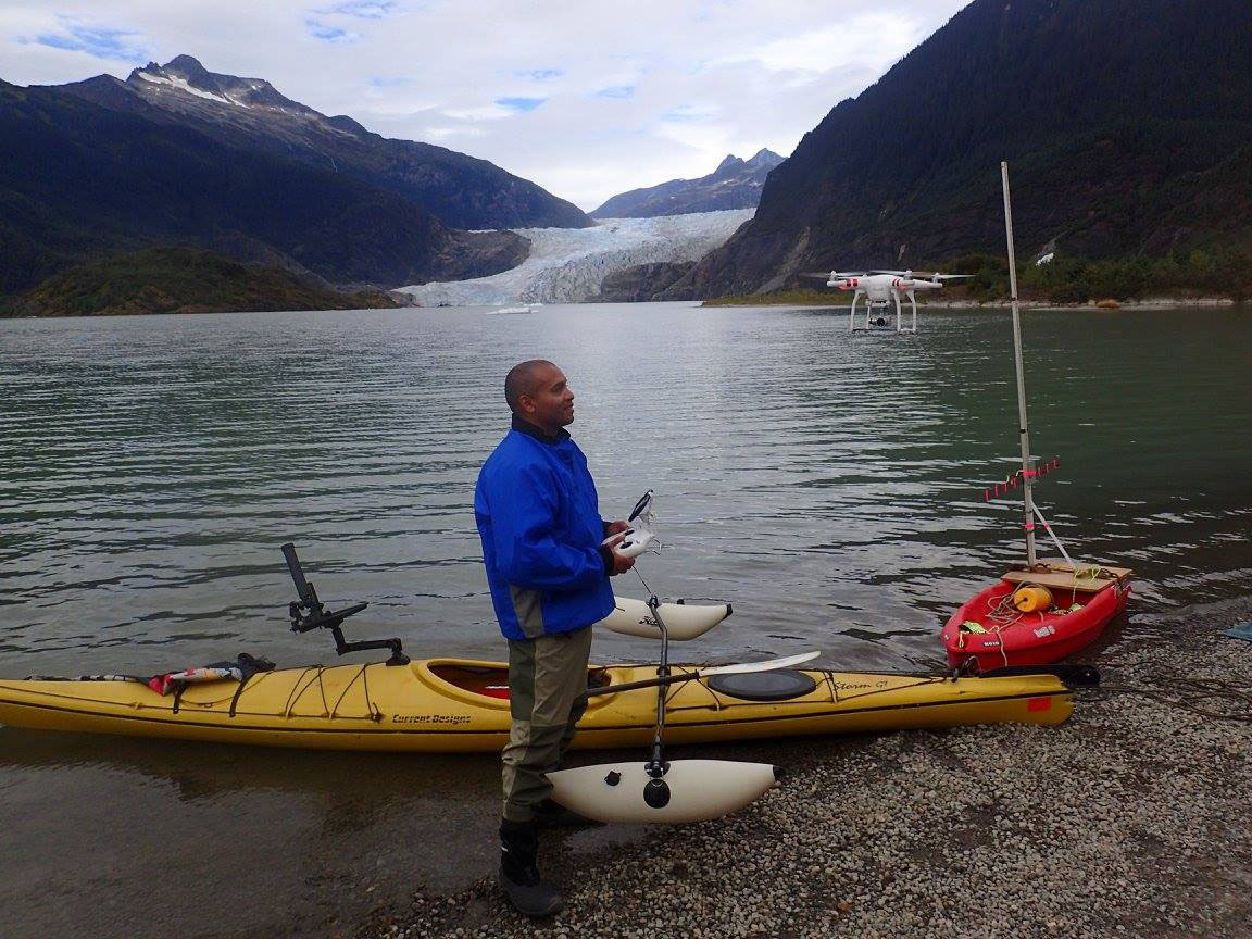 Court Pegus flies a drone in front of Mendenhall Glacier
