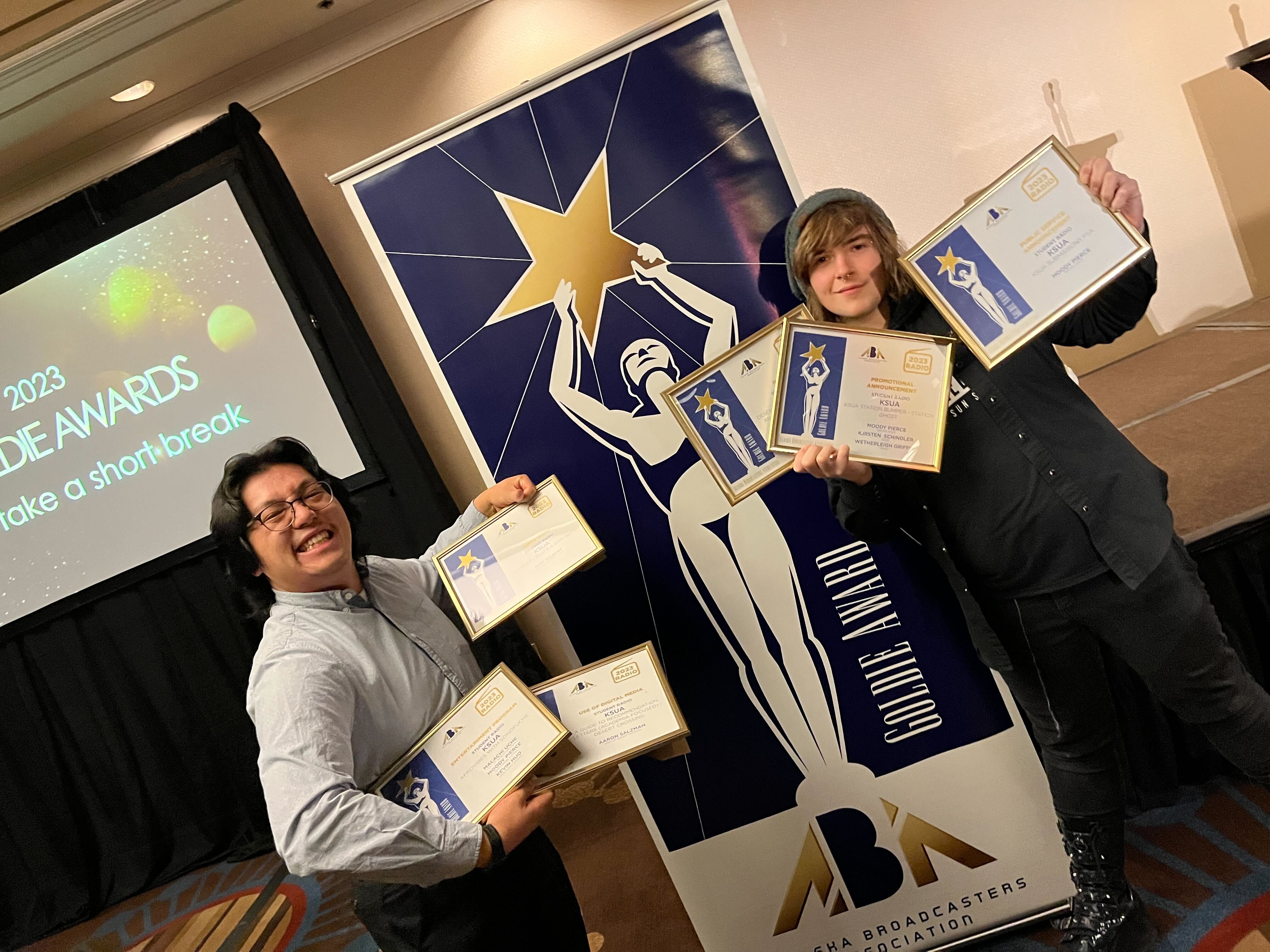 KSUA's General Manager Kevin Huo and Production Director Moody Pierce pose with Goldie awards at the Alaska Broadcasters Association Convention in Anchorage.
