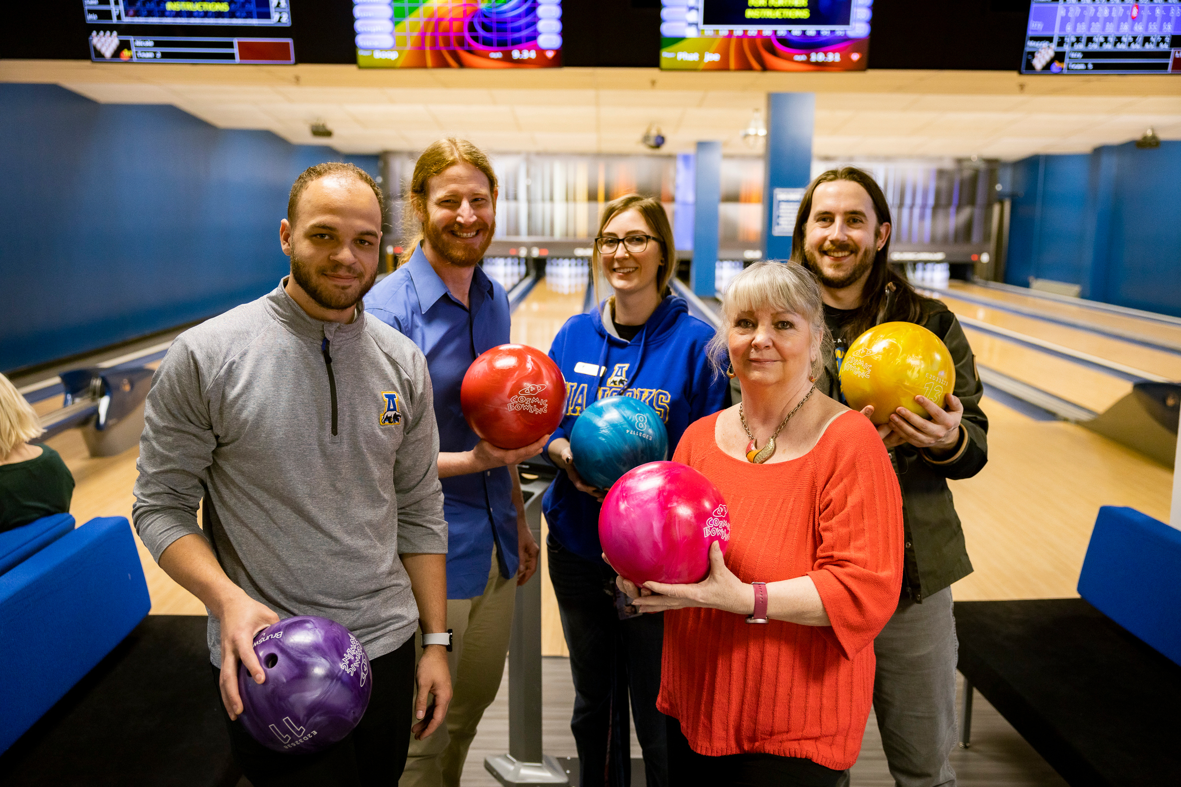 UAF Office of the Bursar staff go bowling during the 2023 Staff Recognition and Development Day. (UAF photo by Leif Van Cise)