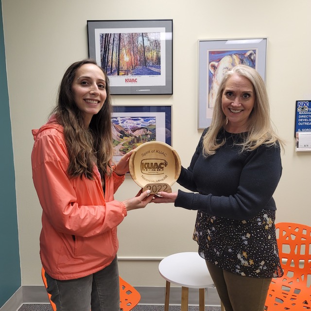 Naomi Hutchquist receives the Spirit of KUAC award from KUAC General Manager Gretchen Gordon.