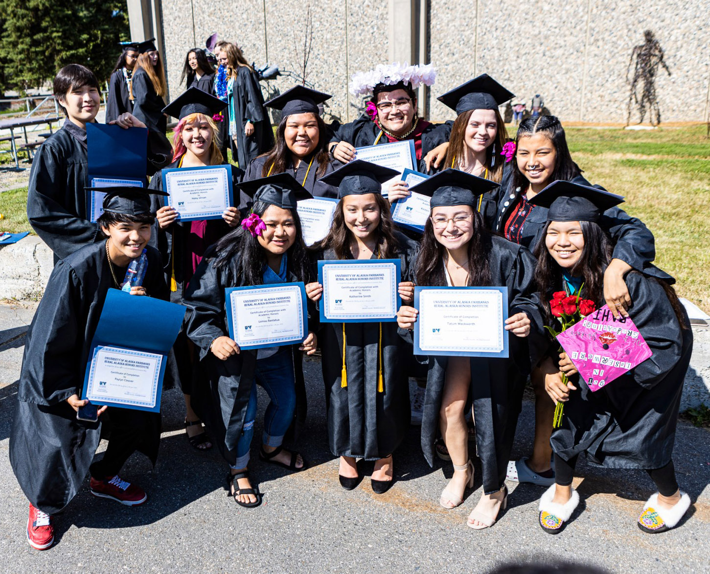 RAHI graduates from 2021 pose with their diplomas.