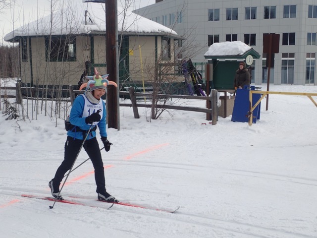 A participant in the 2016 Skiathon crosses the finish line near the UAF ski hut.