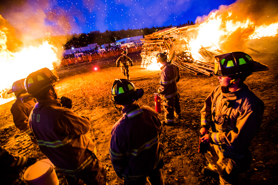 fire fighters near bonfire