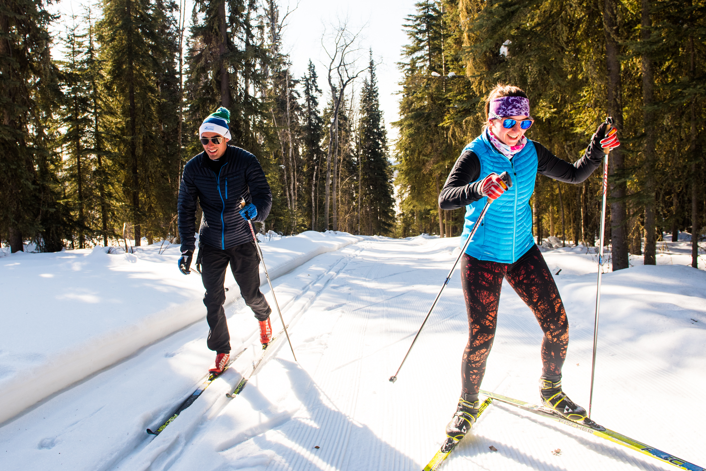 Alaska Nanook skiiers Nick Lovett (left) and Sarissa Lammars (right) go spring skiing one sunny afternoon in late March 2018 on the UAF ski trails behind westridge.