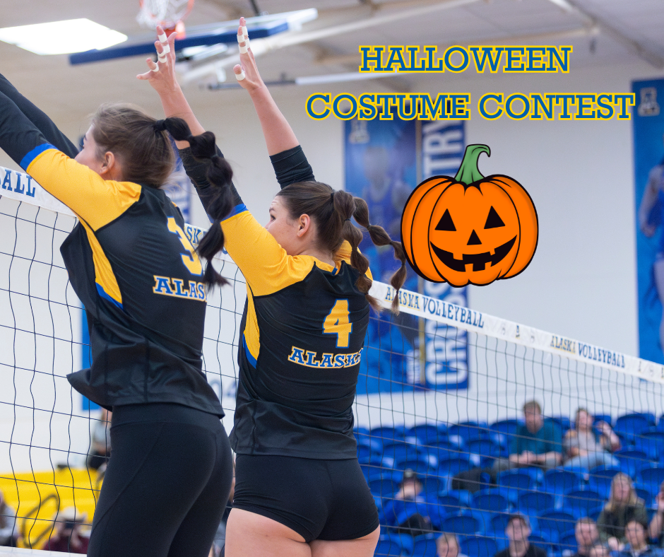 Nanooks Women's Volleyball players jumping to block the ball with the words Halloween Costume Contest and a jack o' lantern graphic superimposed over the top right area of the photo.