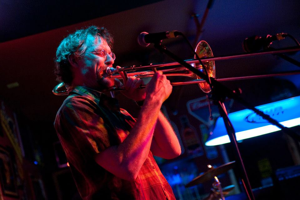 A man plays a trombone