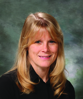 Photo of a woman with blonde hair wearing a black blouse