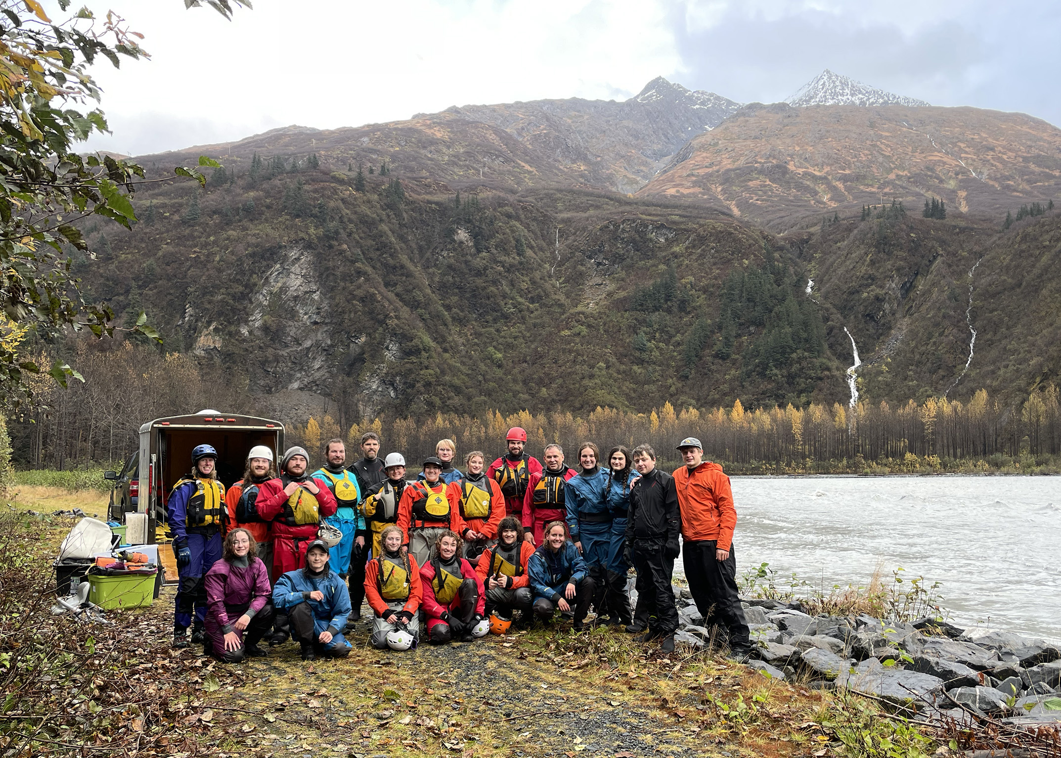 Students, staff and faculty from four universities take a break for a group photo before getting in the water for a rafting trip down the Lowe river through historic Keystone Canyon as part of an outdoor leadership conference.