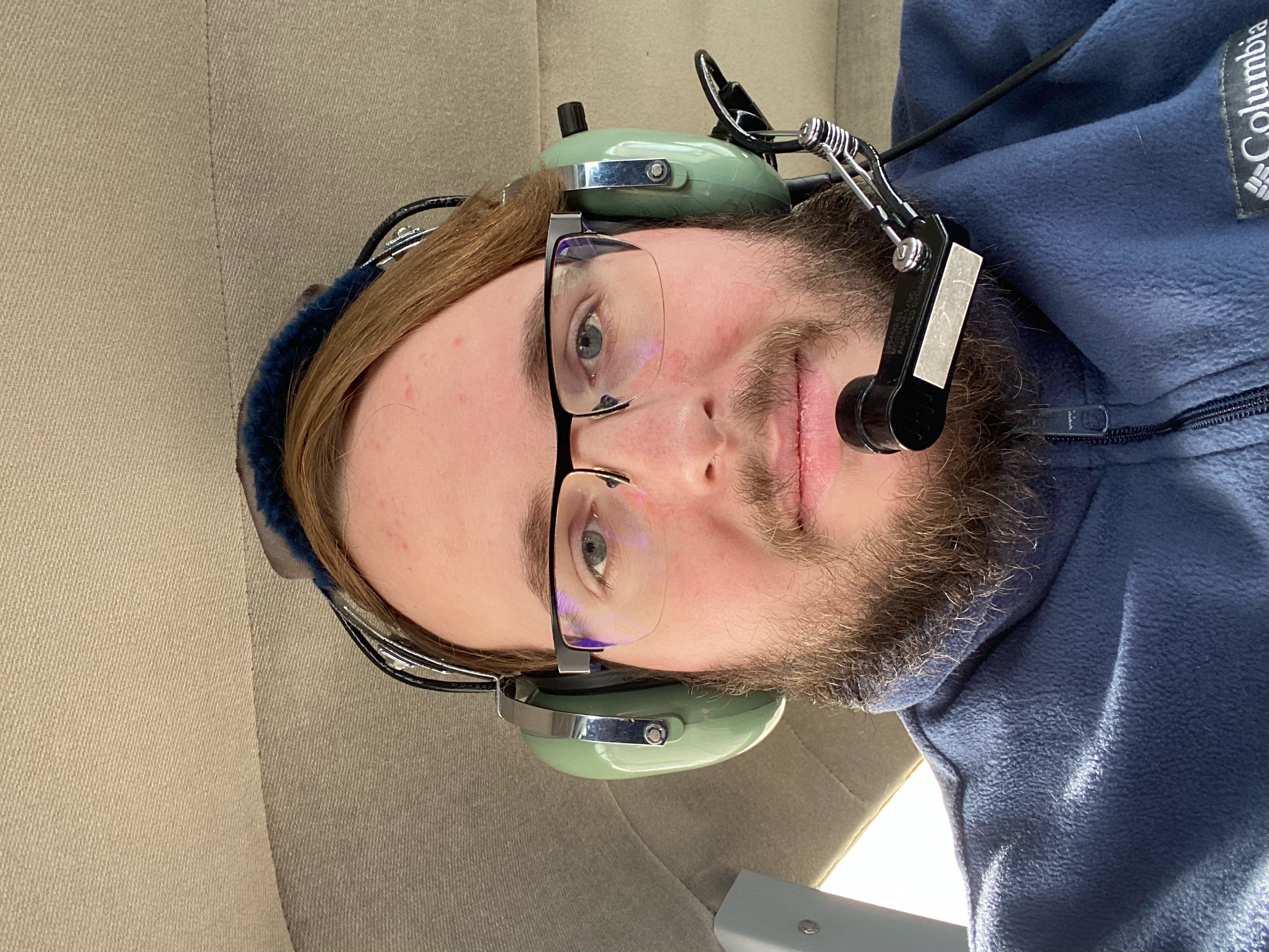 a man wearing an aviation headset