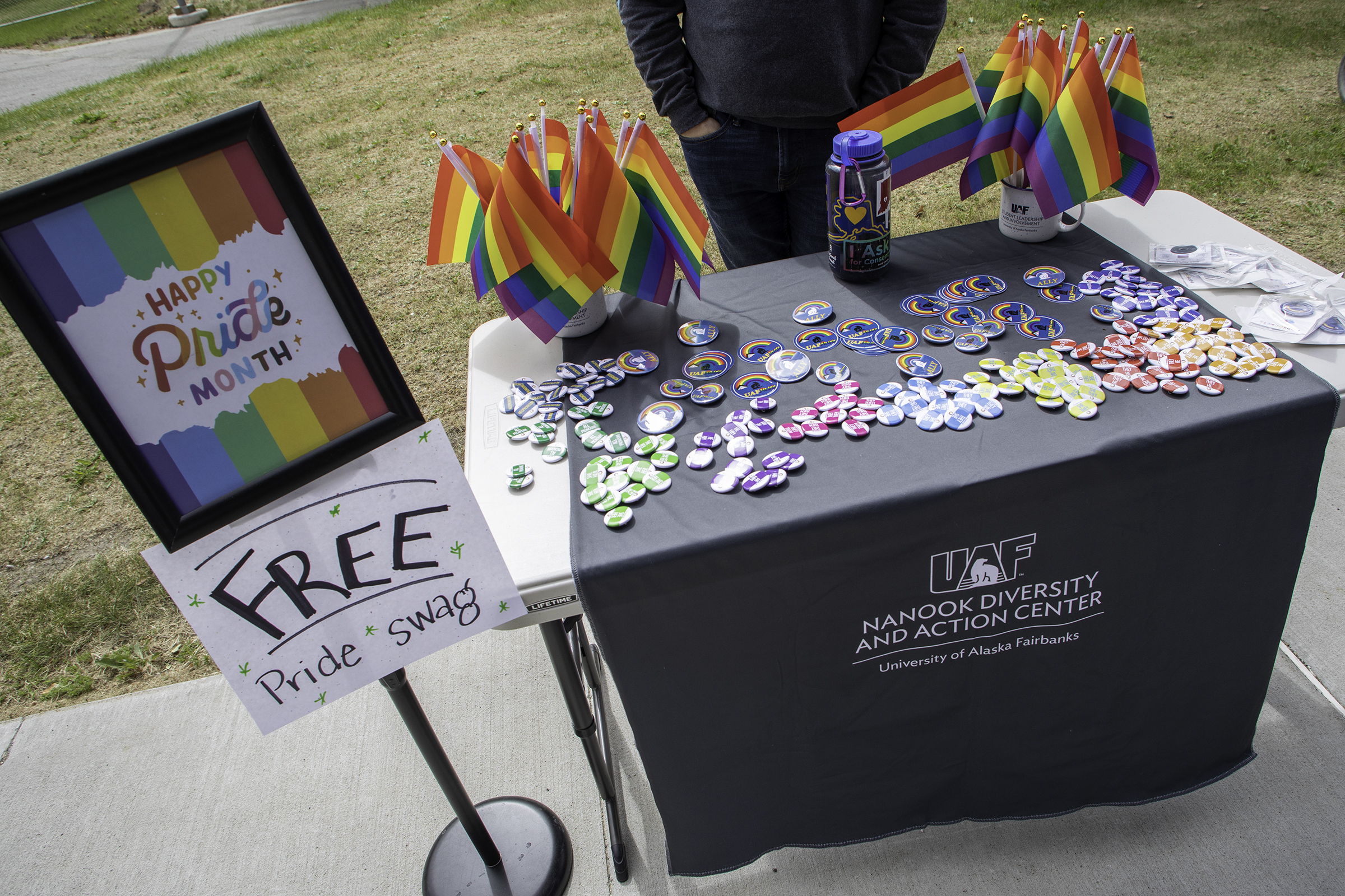Free Pride swag table setup at Ice Cream Thursdays outside the Wood Center.