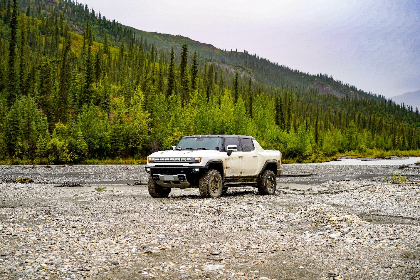 Hummer Electric Vehicle sits on a gravel bed along the Dalton Highway