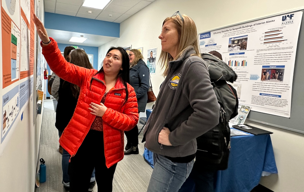 UAF undergraduate student Michelle Ramirez (left) explaining her poster to Tara Borland (right) with U.S. National Science Foundation’s Estab­lished Program to Stim­u­late Com­pet­i­tive Research (EPSCoR) during WAISC 2024. Photo by Dave Partee/Alaska Sea Grant.