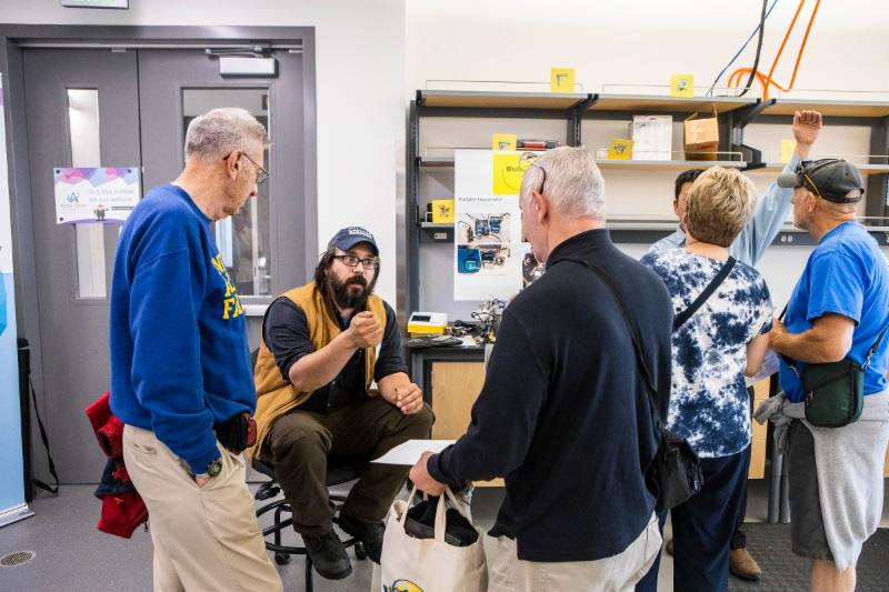 Alumni and community members discussing UAF inventions with faculty, staff,  students, and startup companies during the July 19, 2019 OIPC and Center ICE Open House. Photo by JR Ancheta