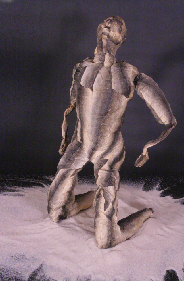 sculpture of a human figure mde from salmon skin by Joel Isaak