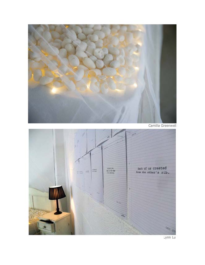 Close up shot of cocoons on bed as well as papers hanging on bedroom wall