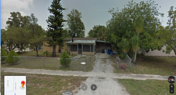 Google street view of a house surrounded by a chain link fence | Photo courtesy of Maggie Wolff