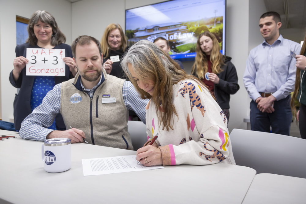 signing ceremony for the UAF/Gonzaga partnership with signers Dean Ellen Lopez and Gonzaga Director of Admissions Luke Cairney (February 2024). 