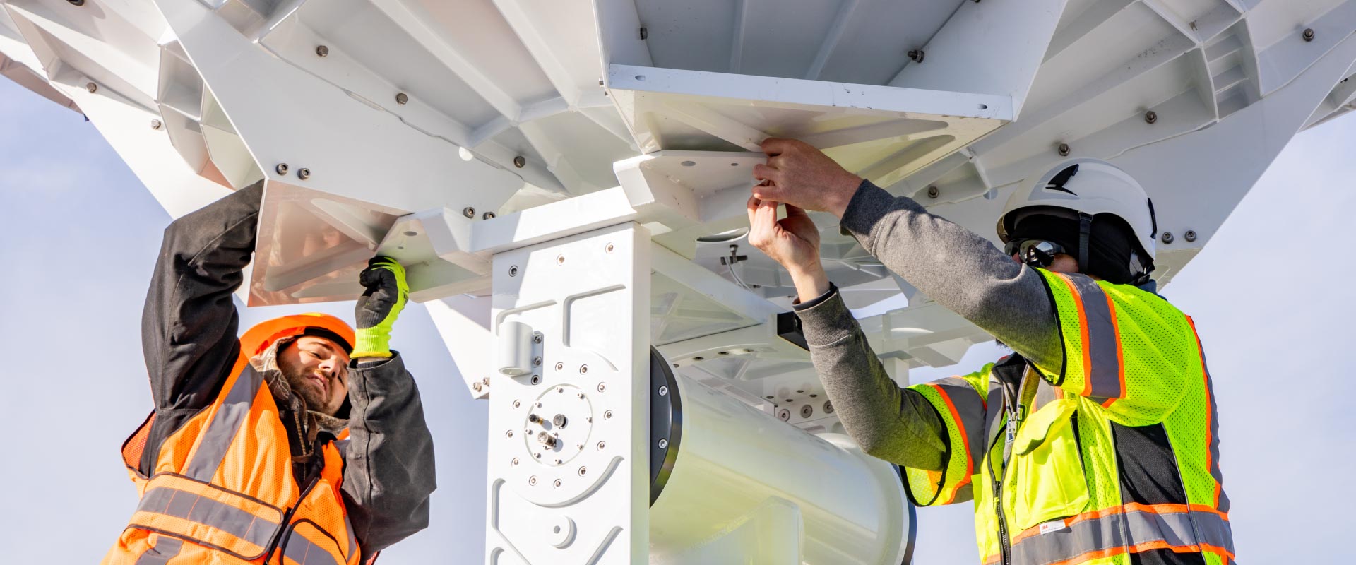 The Geographic Information Network of Alaska (GINA) and UAF Facility Services install a brand new antenna on the roof of the Usibelli Engineering building