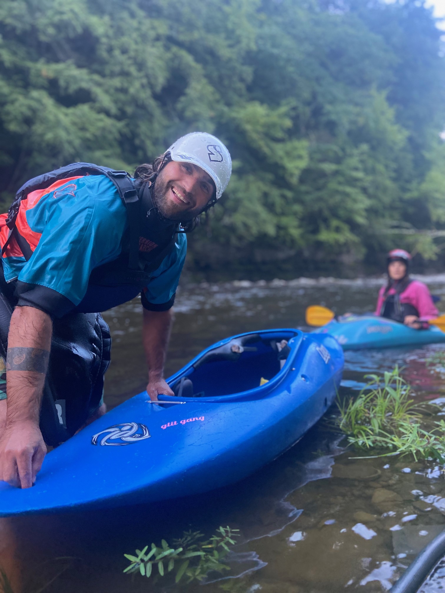 Sam with a blue kayak