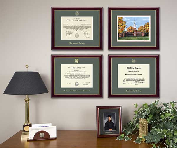 Framed diplomas displayed on an office wall