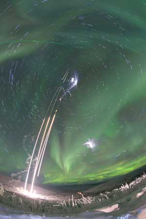 Night time rocket launch from PFRR with aurora