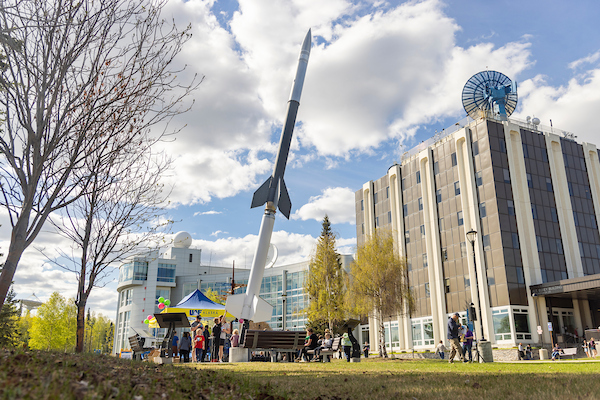 Arctic Research Open House participants on UAF's West Ridge outside the Geophysical Institute and International Arctic Research Center
