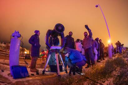 Space physicists from the UAF Geophysical Institute and UAF College of Natural Science and Mathematics set up high-power Celestron telescopes for public use at the Butrovich Building in Fairbanks.