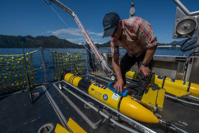 Hank Statscewich, research staff at CFOS, goes out on the RV Nanuq to retrieve one of his research gliders after a record-setting 110-day voyage.