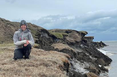 A permafrost geomorphologist from the Institute of Northern Engineering (INE), conducts fieldwork along Alaska’s Arctic coastline