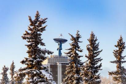 A mid-winter scene depicting the Elvey Building, right, home to UAF's Geophysical Institute.