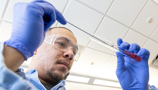 One male student in a lab