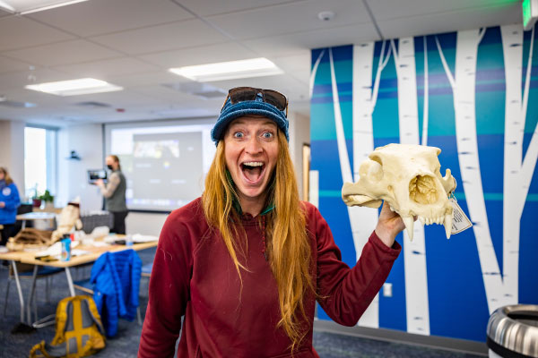 UAF student May Huntley handles a bear head in the School of Education classroom space