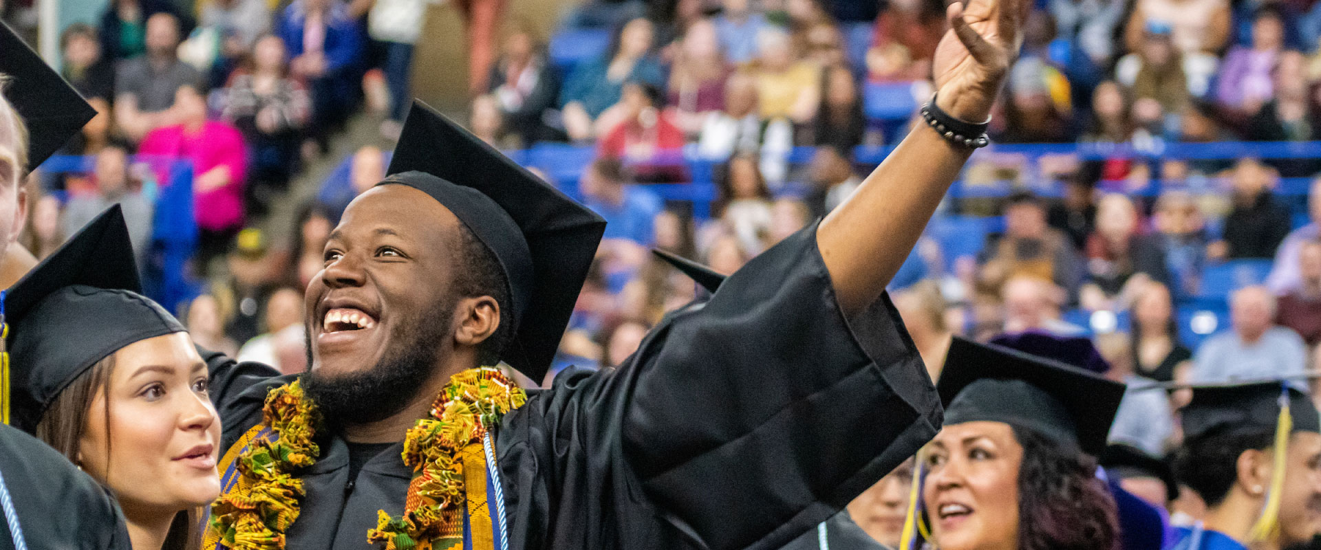 A graduating School of Education student celebrating at the UAF Commencement Ceremony