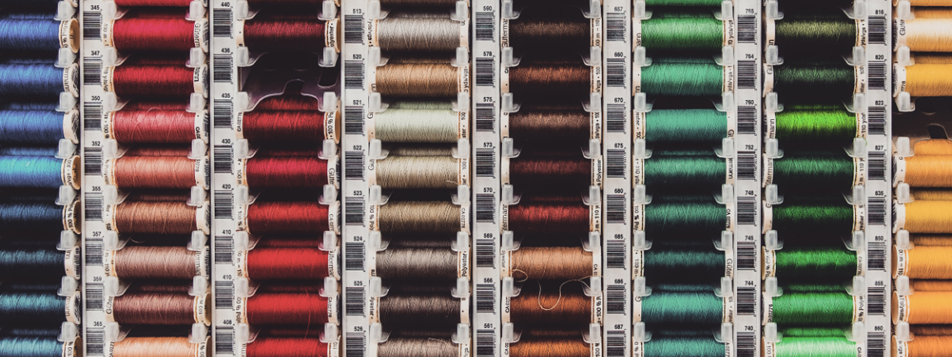 A colorful display of thread spools. Image courtesy of Canva