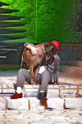 Embracing the bond that knows no bounds: a man and his faithful companion sharing a moment of love on the curb.